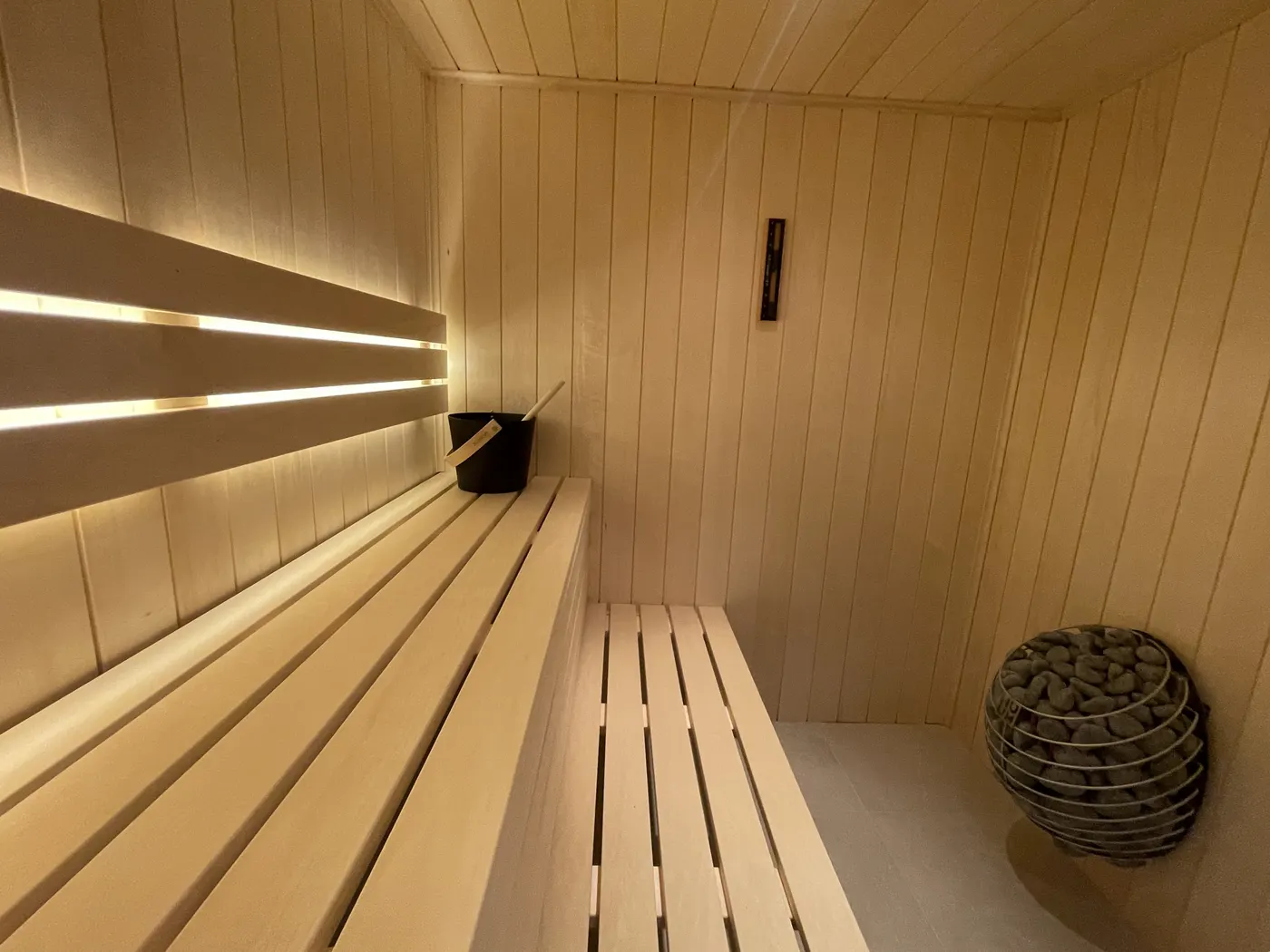 Luxury bespoke sauna interior with timber benches